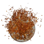 Rooibos neboli čajovec kapský bez kofeinu, který padá do hrnku.